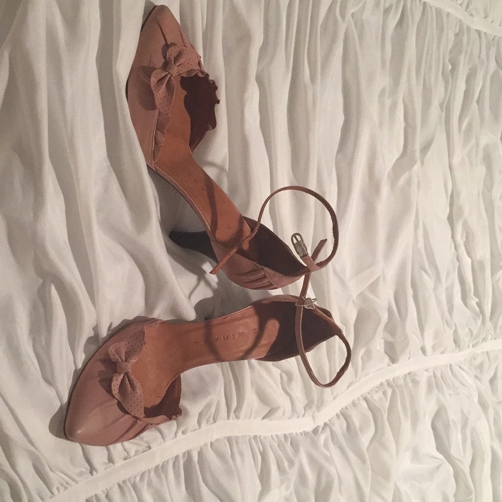 Pale pink strappy heels.